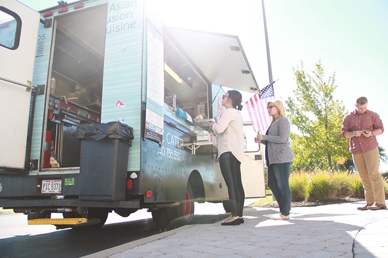RevLocal employees ordering from food truck